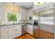Kitchen featuring stainless appliances, granite countertops, and custom cabinetry at 8970 Palmetto Rd, Edisto Island, SC 29438