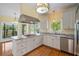 Charming kitchen with stainless appliances, granite countertops, and a center island at 8970 Palmetto Rd, Edisto Island, SC 29438