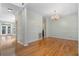 Spacious living room with hardwood floors and easy access to other parts of the house at 8970 Palmetto Rd, Edisto Island, SC 29438