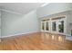 Spacious living room featuring hardwood floors, a fireplace, and high ceilings at 8970 Palmetto Rd, Edisto Island, SC 29438