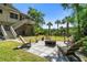 Cozy backyard patio with seating and a fire pit, perfect for outdoor entertaining and relaxation at 8970 Palmetto Rd, Edisto Island, SC 29438