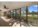 The screened porch has wood floors, ceiling fans and offers beautiful views of the surrounding marsh and river at 8970 Palmetto Rd, Edisto Island, SC 29438