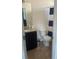 Bathroom featuring a toilet, vanity with granite countertop, and shower with curtain at 9217 Southern Oak Ln, Ladson, SC 29456