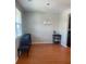 Bright dining room with hardwood floors and elegant chandelier lighting fixture at 9217 Southern Oak Ln, Ladson, SC 29456
