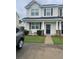 Charming two-story home with well-maintained lawn and inviting entrance at 9217 Southern Oak Ln, Ladson, SC 29456