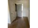 Hallway with visible laundry closet and neutral-toned walls and carpet at 9217 Southern Oak Ln, Ladson, SC 29456