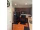 Modern kitchen with stainless steel appliances, granite countertops, and dark wood cabinetry at 9217 Southern Oak Ln, Ladson, SC 29456
