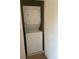Convenient laundry closet featuring a stacked washer and dryer unit at 9217 Southern Oak Ln, Ladson, SC 29456