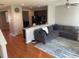 Open-concept living room with a large sectional sofa and hardwood floors at 9217 Southern Oak Ln, Ladson, SC 29456