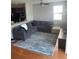 Cozy living room featuring a comfortable sectional sofa and area rug at 9217 Southern Oak Ln, Ladson, SC 29456