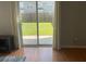 Sliding glass doors open to a lush green backyard at 9217 Southern Oak Ln, Ladson, SC 29456