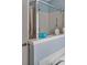 Bathroom featuring glass shower with blue accent walls, built-in niche, and fixtures at 9923 Honeylocust Ln, Ladson, SC 29456