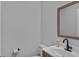 Half bathroom featuring modern vanity, faucet, mirror, toilet, and neutral paint at 9923 Honeylocust Ln, Ladson, SC 29456