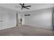 Bedroom featuring neutral carpeting, ceiling fan and access to an on-suite bath at 9923 Honeylocust Ln, Ladson, SC 29456
