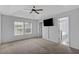 Bedroom featuring ceiling fan, large window, and ensuite bathroom at 9923 Honeylocust Ln, Ladson, SC 29456
