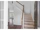 Welcoming foyer with hardwood floors, staircase, and abundant natural light, creating an inviting atmosphere at 9923 Honeylocust Ln, Ladson, SC 29456