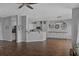 Inviting living space featuring hardwood floors, neutral decor, and a seamless flow into the kitchen area at 9923 Honeylocust Ln, Ladson, SC 29456