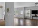 Open-concept living area with hardwood floors, natural light, and modern decor, perfect for relaxation and entertainment at 9923 Honeylocust Ln, Ladson, SC 29456