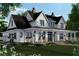 Charming two-story home featuring a covered porch, black window frames, and landscaped front yard at 0 Faulkner Dr, Mount Pleasant, SC 29466