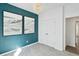 Bedroom with decorative accent wall, light gray carpeting, and modern chandelier at 1007 Swamp Rose Run, Summerville, SC 29485