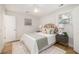 Bedroom with neutral decor, featuring a patterned headboard, plush bedding, and a cozy rug at 1010 Fiall St, Charleston, SC 29407