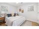 A beautifully decorated bedroom with throw pillows, light colored walls, and natural lighting at 1010 Fiall St, Charleston, SC 29407