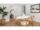 Contemporary dining area featuring clean lines, minimalist decor, and hardwood flooring, offering an open layout at 1010 Fiall St, Charleston, SC 29407