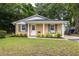 Charming single-story brick home with a well-manicured lawn, neutral paint, and inviting curb appeal at 1010 Fiall St, Charleston, SC 29407