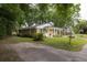 A view of the house from the street, showing the yard, driveway and mailbox at 1010 Fiall St, Charleston, SC 29407