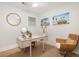 A cozy home office provides a great workplace with charming décor and natural light at 1010 Fiall St, Charleston, SC 29407