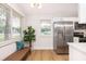 Updated kitchen with stainless steel appliances, white cabinets, and a convenient bench seating area at 1010 Fiall St, Charleston, SC 29407