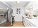 Modern kitchen with stainless steel appliances, white cabinets, and hardwood floors, offering a sleek design at 1010 Fiall St, Charleston, SC 29407
