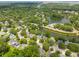 Scenic aerial view of the community featuring tree-lined streets, water features, and well-maintained homes at 1027 Wayfarer Ln, Charleston, SC 29412