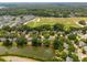 Wide aerial shot featuring the expansive community, surrounded by lush greenery, athletic fields, and serene waterways at 1027 Wayfarer Ln, Charleston, SC 29412
