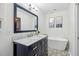 Bright bathroom with a standalone tub, stylish vanity and patterned tile floor at 1027 Wayfarer Ln, Charleston, SC 29412