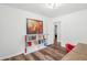 Neutral bedroom with wood floors and an adjacent sitting room/office space at 1027 Wayfarer Ln, Charleston, SC 29412