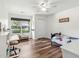 Bright bedroom with laminate flooring, desk area, and lots of natural light at 1027 Wayfarer Ln, Charleston, SC 29412