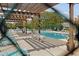 Community pool with pergola and plenty of lounging chairs offers a place to cool off at 1027 Wayfarer Ln, Charleston, SC 29412