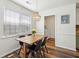 Bright dining area with stylish wood table and bead chandelier next to a large window at 1027 Wayfarer Ln, Charleston, SC 29412