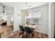 Bright dining area showcases modern table and chairs next to a large window at 1027 Wayfarer Ln, Charleston, SC 29412