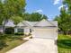 Charming single-story home featuring a spacious two-car garage, well-maintained landscaping, and a welcoming driveway at 1027 Wayfarer Ln, Charleston, SC 29412