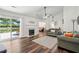 Spacious living room with fireplace, hardwood floors, lake view, and comfortable furnishings at 1027 Wayfarer Ln, Charleston, SC 29412
