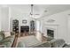 Cozy living room includes a fireplace, hardwood floors, and access to the outdoors at 1027 Wayfarer Ln, Charleston, SC 29412
