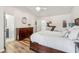 Bright bedroom features wood floors, a ceiling fan, and ample space at 1027 Wayfarer Ln, Charleston, SC 29412