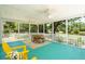 Inviting screened porch featuring a seating area and scenic water view, perfect for outdoor relaxation at 1027 Wayfarer Ln, Charleston, SC 29412
