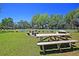 Community tennis courts with picnic tables and lush green landscaping offer a relaxing outdoor space at 1027 Wayfarer Ln, Charleston, SC 29412