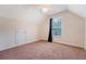 Bedroom with carpet, neutral walls, large bright window, ceiling fan, and door at 1042 Cobblestone Blvd, Summerville, SC 29486