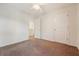 Bedroom with neutral walls, carpet flooring, ceiling fan, and two doors at 1042 Cobblestone Blvd, Summerville, SC 29486