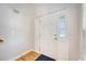 Bright foyer with hardwood floors and a white front door with sidelights at 1042 Cobblestone Blvd, Summerville, SC 29486