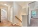 Upstairs hallway with carpet, doors to bedrooms, bathroom and stairs to lower level at 1042 Cobblestone Blvd, Summerville, SC 29486